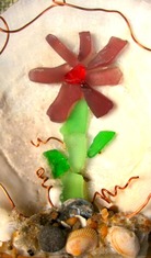 Flower made out of sea glass. Seaglass craft tutorials at www.shellcrafter.com